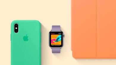 Foto de um iPhone com capa cor hortelã, um Apple Watch com pulseira Lilás e um iPad com capa frontal laranja